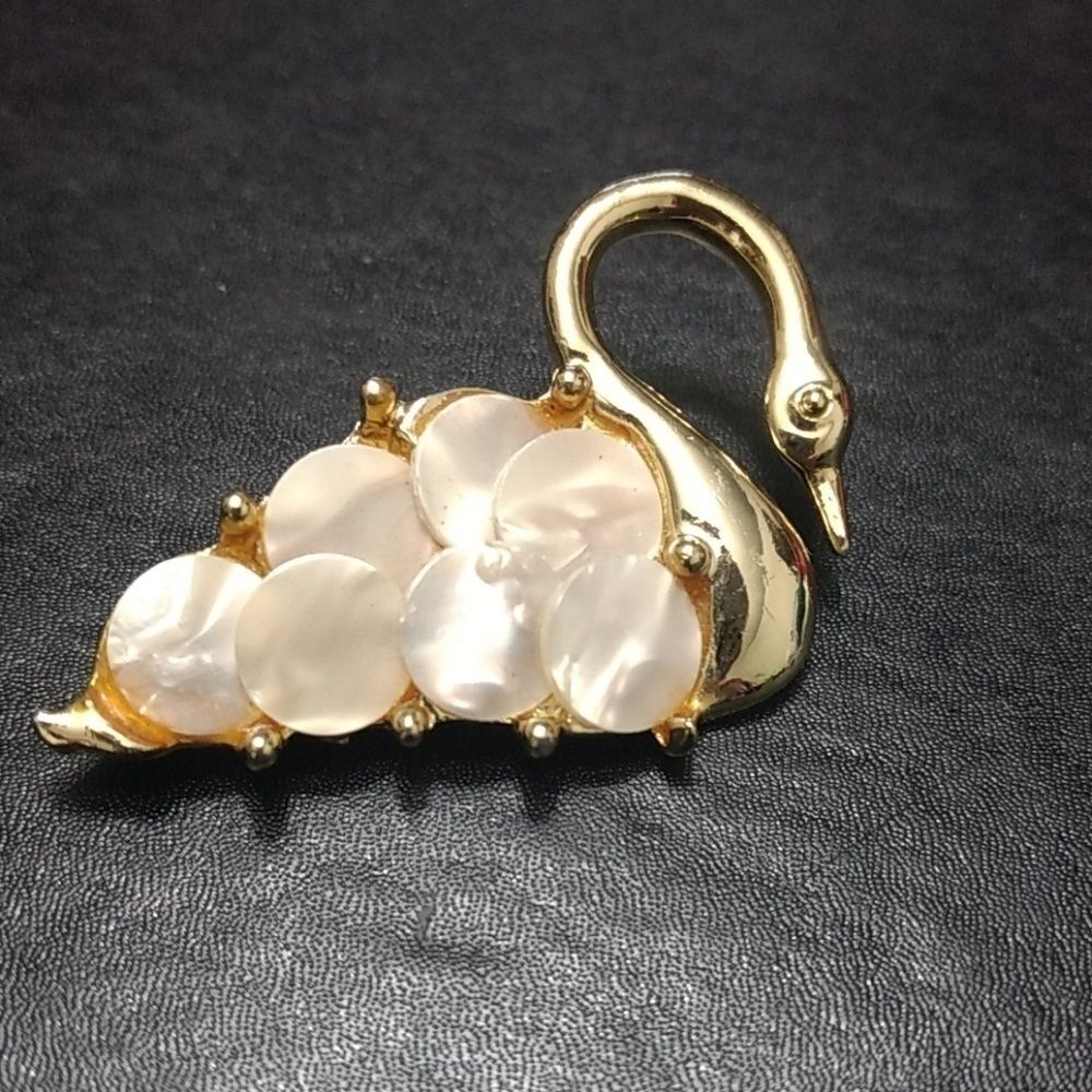 Vintage gold tone mother of pearl swan brooch